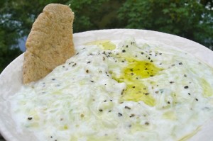 tzatziki finished and dipping in pita breads