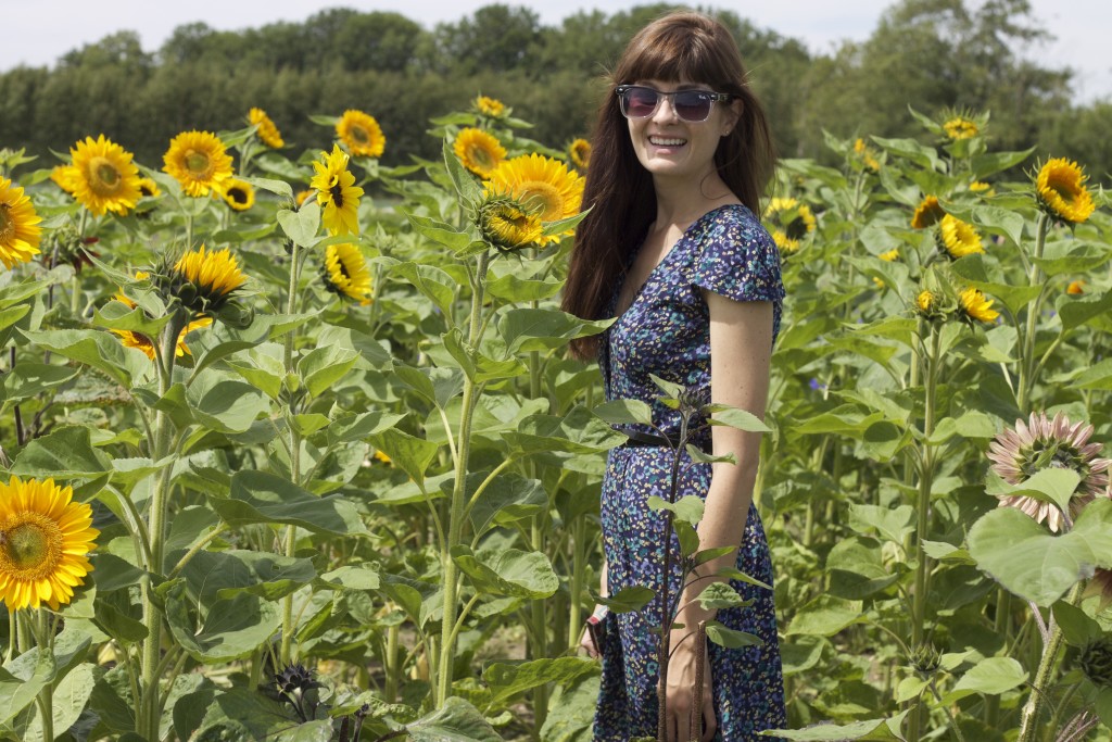 smiling with sunflowers