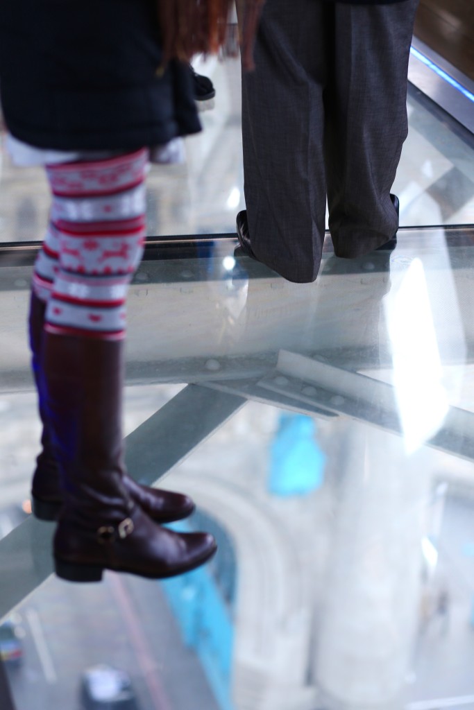 standing on glass walkway