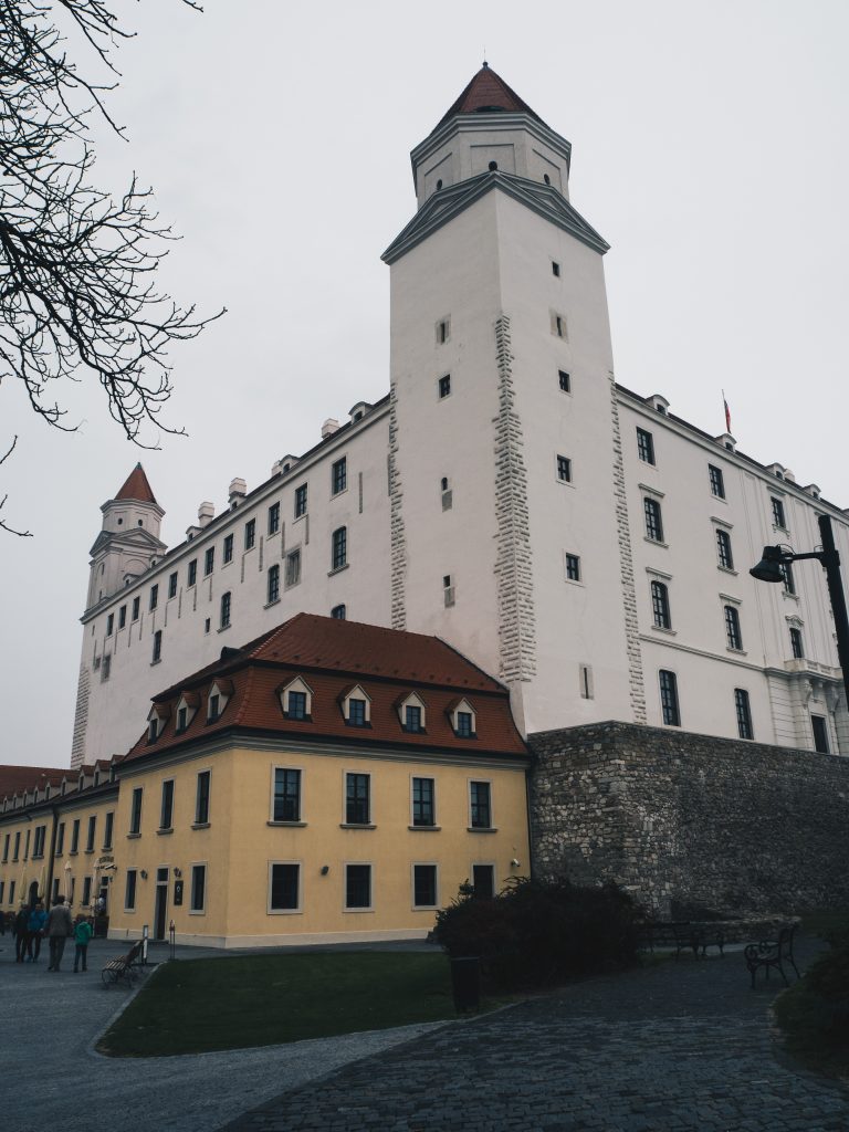yellow building and Bratislava Castle