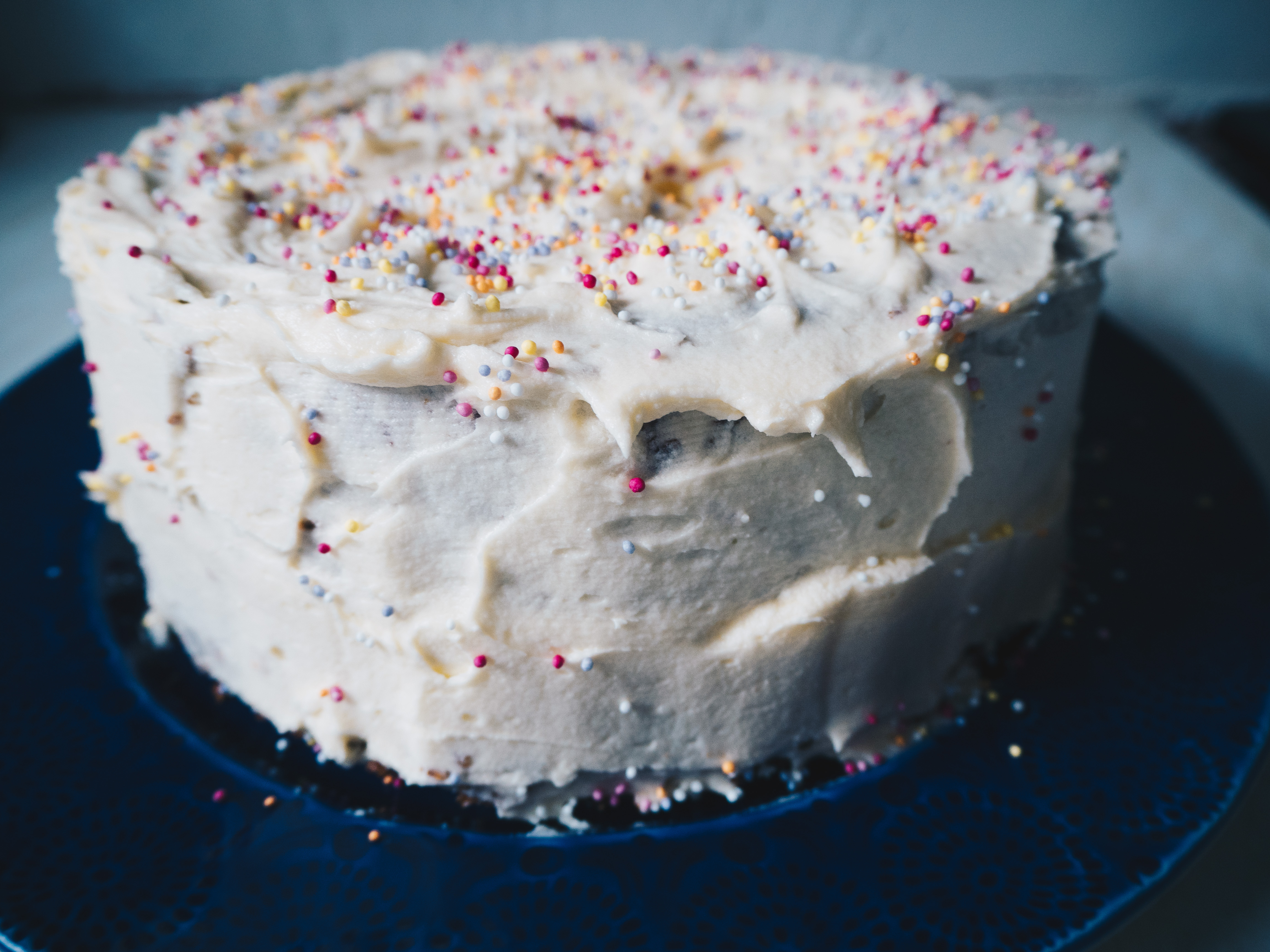 frosted vegan vanilla sprinkles cake